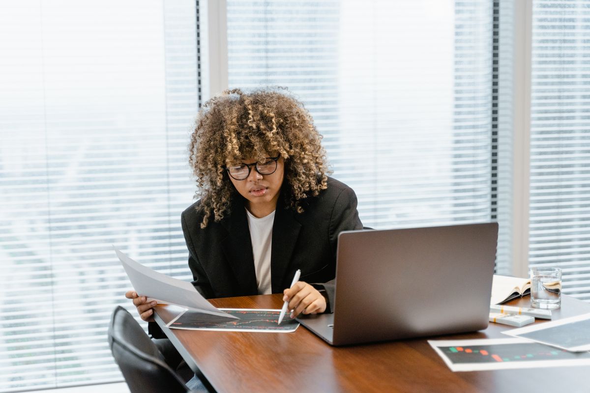 Professional analyzing marketing charts at a desk